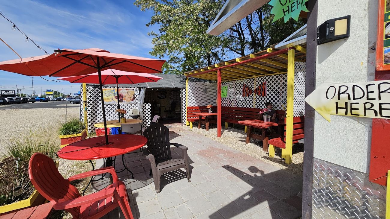 The outdoor patio at Lorena's Mexican Grill on Fairview Ave in Boise, with red umbrellas and an Order Here sign